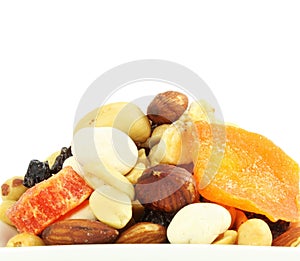 Mixed dried fruits nuts trail mix closeup in white background