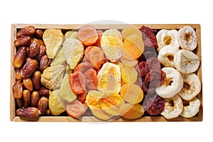 mixed of dried fruits in wooden box isolated on white background