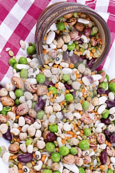 Mixed dried legumes and cereals isolated on white background, top view