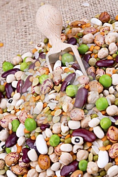 Mixed dried legumes and cereals isolated on white background, top view