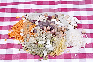 Mixed dried legumes and cereals isolated on white background, top view