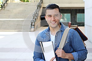 Mixed ethnicity student smiling on campus