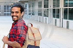 Mixed ethnicity student smiling on campus