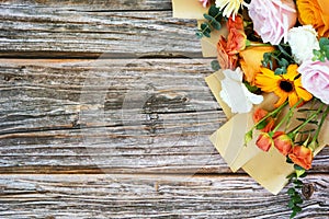 Mixed flower bouquet on top of wood background