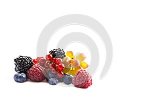 Mixed of fresh fruits and berries isolated on a white background. Ripe blueberries, blackberries, red currants, grapes, raspberrie