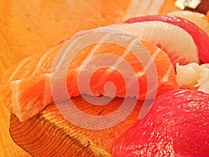 Mixed fresh Japanese sushi platter served on wooden plate