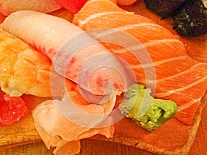 Mixed fresh Japanese sushi platter served on wooden plate