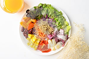 Mixed fresh salad organic vegetables with quinoa seeds and juice, Healthy vegan food