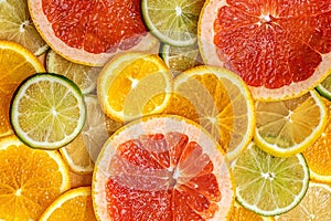 Mixed Fresh slices citrus fruit as background. Top view