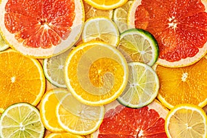 Mixed Fresh slices citrus fruit as background. Top view