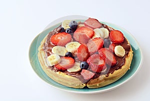 Mixed fruit with chocolate spread on a waffle