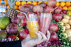 Mixed fruit juice and fresh orange juice on fruit background