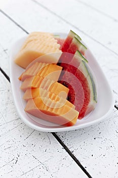 Fruit plate on white wooden table