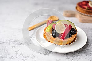 mixed fruit tart on a light table. Delicious bakery and pastry