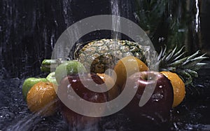 Mixed fruit.there are Pineapple,Apple and orange put on background