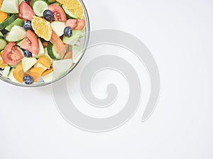 Mixed fruit and vegetable salad in a glass bowl