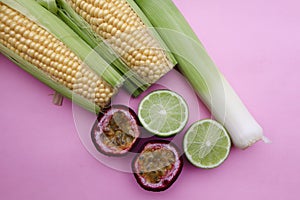 Mixed Fruit and Vegetables on a Pale Pink Background