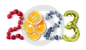 Mixed fruits. New year 2023 made of fruits on the white background. Healthy food