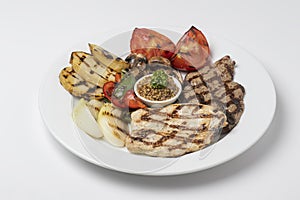 Mixed Grill of Chicken Breast and Beef served with tomatoes, mushroom and pepper