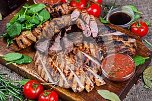 Mixed grilled meat platter. Assorted delicious grilled meat with vegetable.
