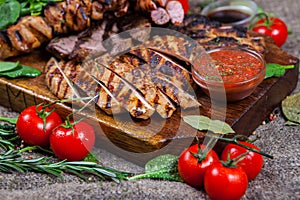 Mixed grilled meat platter. Assorted delicious grilled meat with vegetable.