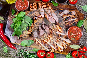 Mixed grilled meat platter. Assorted delicious grilled meat with vegetable.