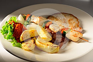 Mixed Grilled meat and vegetables decorated on a plate ready to be served in restaurant