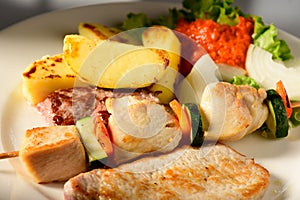 Mixed Grilled meat and vegetables decorated on a plate ready to be served in restaurant