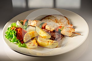 Mixed Grilled meat and vegetables decorated on a plate ready to be served in restaurant