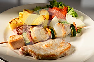 Mixed Grilled meat and vegetables decorated on a plate ready to be served in restaurant