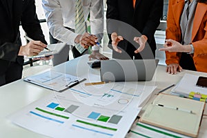 Mixed group of business people sitting around a table and working, Business team working on a project in the office around a table