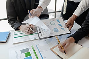 Mixed group of business people sitting around a table and working, Business team working on a project in the office around a table