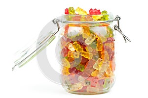 Mixed gummy bears / jelly baby candy sweets in an open jar