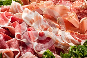 Mixed hams and salami display