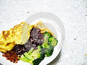 Mixed homemade food easy meal omlet rice vegetable dish