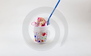Mixed ice cream in sundae cup on white background