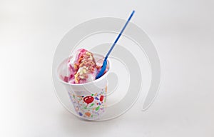 Mixed ice cream in sundae cup on white background