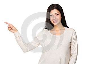 Mixed indian woman with finger point aside