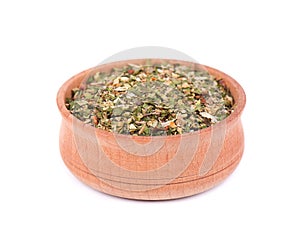 Mixed Italian Herbs Seasoning in a wooden bowl isolated on white background. Dried Herbs Seasoning, ingredient for