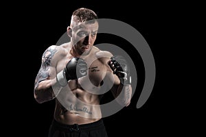 Mixed martial artist posing on a black background. Concept of mma, ufc, thai boxing, classic boxing