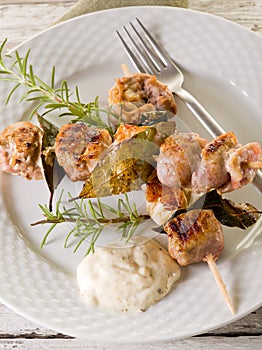 Mixed meat skewer on dish