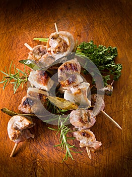 Mixed meat skewer on wooden