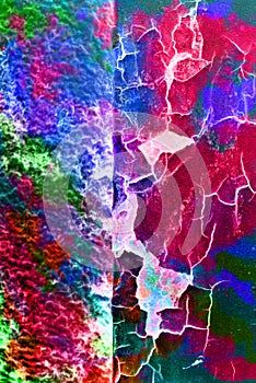 Mixed media artwork, abstract colorful artistic painted layer in red, blue, green color palette on grunge cracked texture