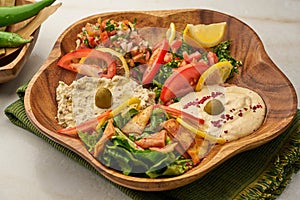 Mixed Mezza with salad and lime served in a dish isolated on grey background side view of fastfood photo