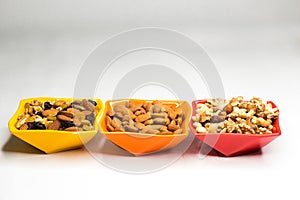 Mixed nuts in  colored bowls