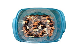Mixed nuts and dried fruits in wooden bowl on wooden background, top view, banner. Healthy snack - mix of organic nuts and dry