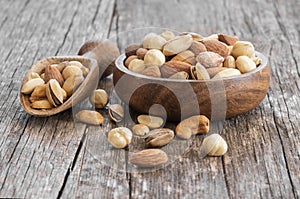 Mixed Nuts, dried fruits on wooden table, different kind of healthy food