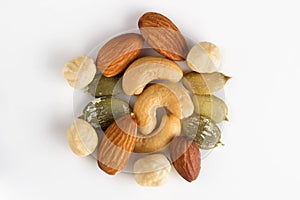Mixed nuts and seeds on white background close up