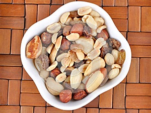 Mixed nuts in a white bowl
