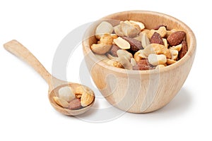 Mixed nuts in wooden bowl isolated on white background
